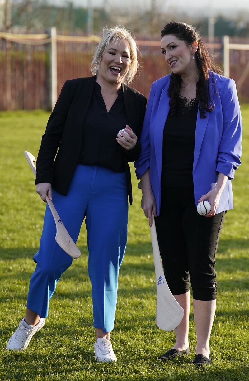Michelle O’Neill and Emma Little-Pengelly during a visit to St Paul’s GAA club in west Belfast