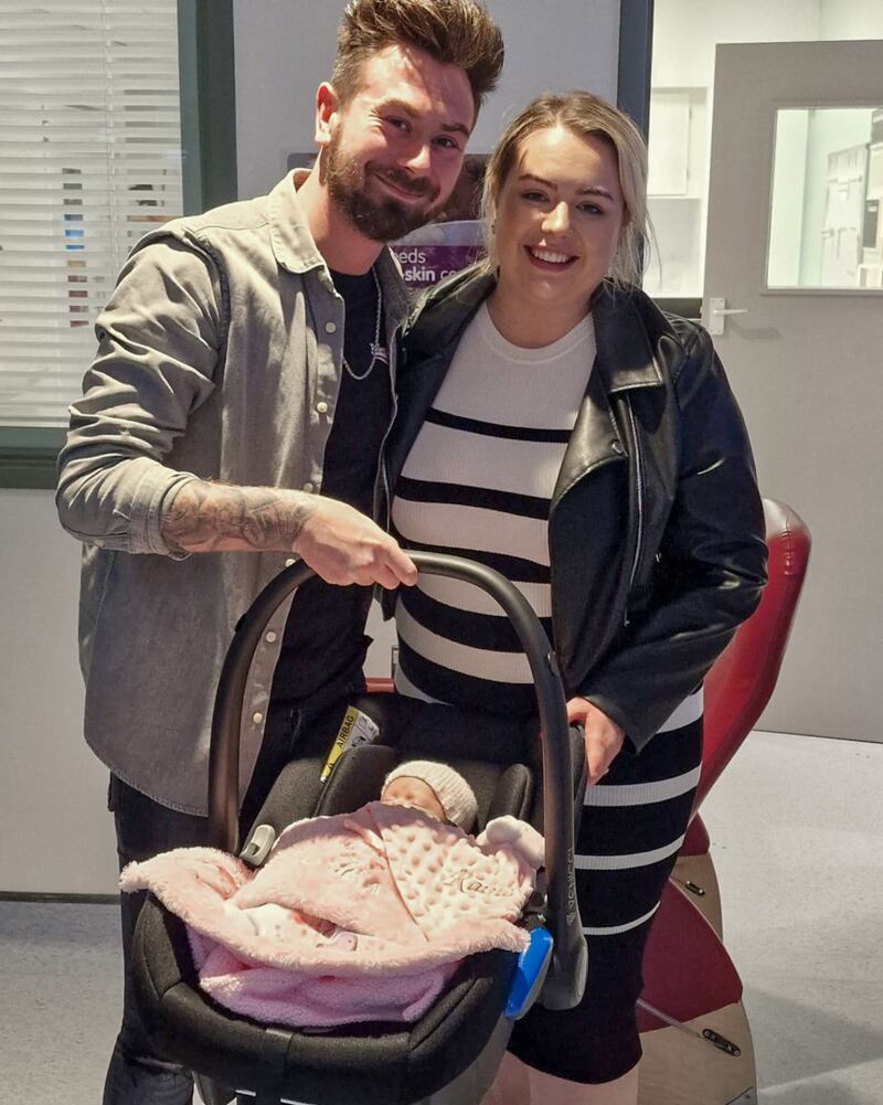 Marcus and Rachel Gilmore with their daughter Raina leaving Antrim Area Hospital. Picture date: Thursday December 21, 2023. PA Photo. See PA story ULSTER Baby. Photo credit should read: Gilmore Family/PA Wire