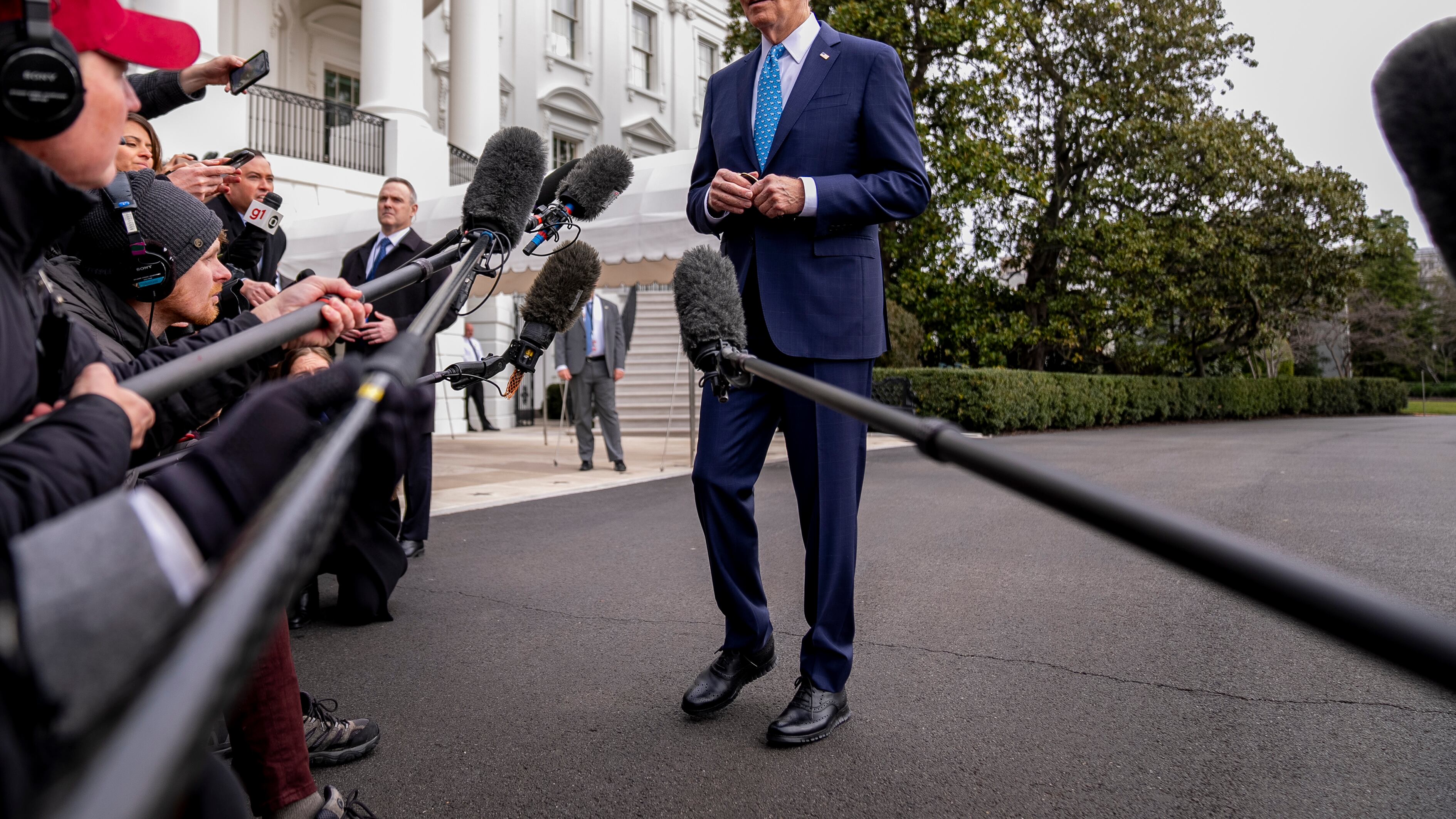 US President Joe Biden speaks to reporters before boarding Marine One on the South Lawn of the White House in Washington (Andrew Harnik/AP)