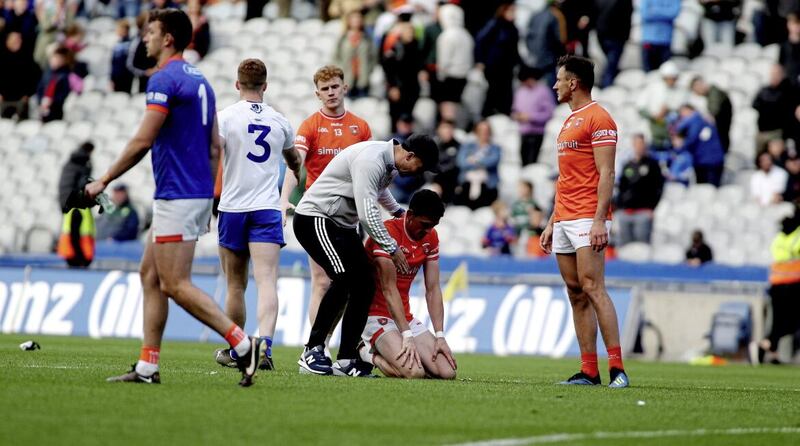 Vinny Corey commiserates with Armagh&#39;s Rory Grugan after their All-Ireland quarter-final penalty shoot-out win 