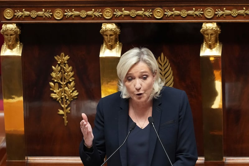 Far-right leader Marine Le Pen delivers her speech at the National Assembly prior to a no-confidence vote that could bring down the government (AP Photo/Michel Euler)