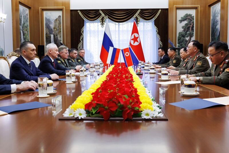 Russia’s Andrei Belousov speaks across a table to North Korean defence minister No Kwang Chol (Vadim Savitsky, Russian Defence Ministry Press Service via AP)