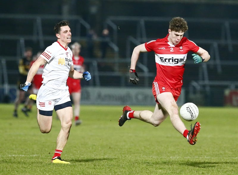 Enda Downey of Derry gets away from Tyrone's David Mulgrew during the Dr McKenna Cup final      Picture: Philip Walsh