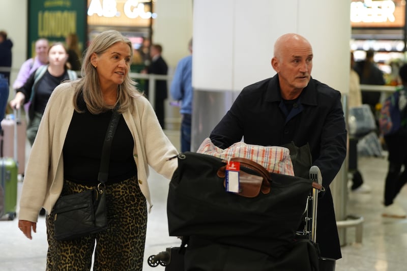 Barry McGuigan and his wife Sandra arrive at the airport