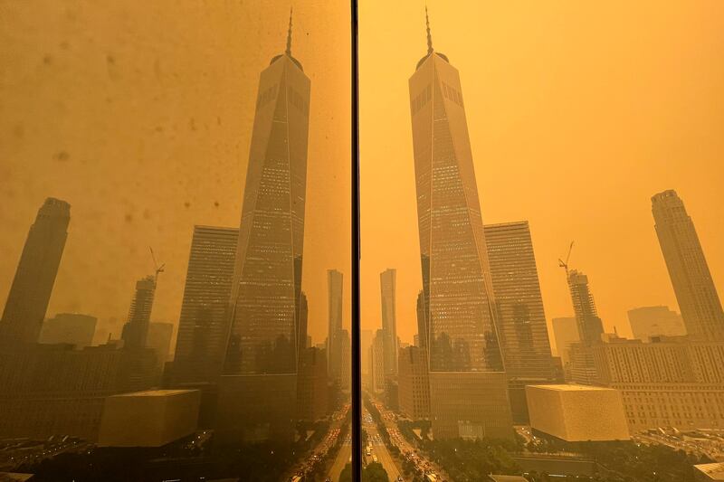 Smoke from the Canadian wildfires blanketed New York City while pouring more carbon into the atmosphere (Andy Bao/AP)