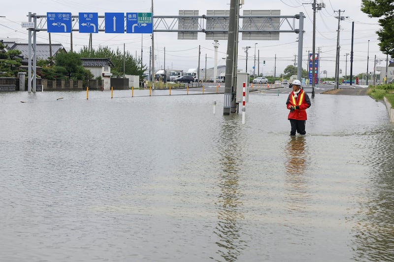 A flooded road in Sakata, Yamagata prefecture (Kyodo News/AP)