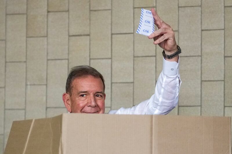 The opposition’s presidential candidate Edmundo Gonzalez shows his ballot as he votes in the presidential election in Caracas (Matias Delacroix/AP)