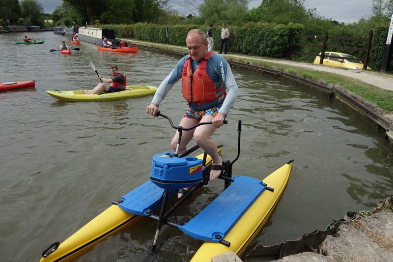 Liberal Democrat leader Sir Ed Davey uses an aqua-bike on the River Cherwell in Oxford