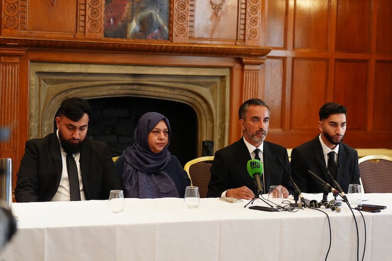 Brothers Muhammed Amaad, 25, left, and Mohammed Fahir Amaaz, 19, right, with their mother and family solicitor during a press conference in Manchester in August