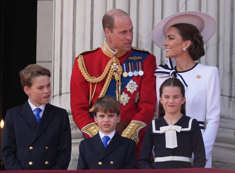 The Prince and Princess of Wales with their children, Prince George, Prince Louis, and Princess Charlotte, on the balcony of Buckingham Palace