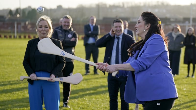 Northern Ireland First Minister Michelle O’Neill (left) and deputy First Minister Emma Little-Pengelly during a visit to St Paul’s GAA club in west Belfast