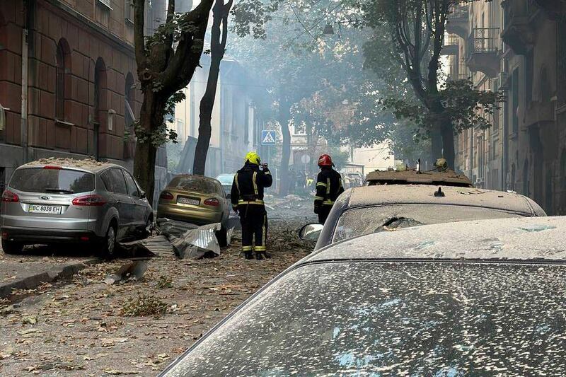 Firefighters work near a residential building damaged by a Russian strike in Lviv on Wednesday (Lviv City Council via AP)