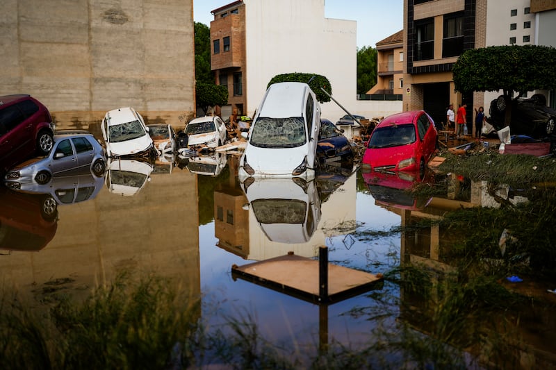 Flooded cars piled up in Valencia, Spain (Manu Fernandez/AP)