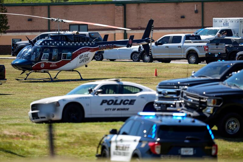 A medical helicopter is seen in front of Apalachee High School after the shooting at the school on Wednesday (Mike Stewart/AP)