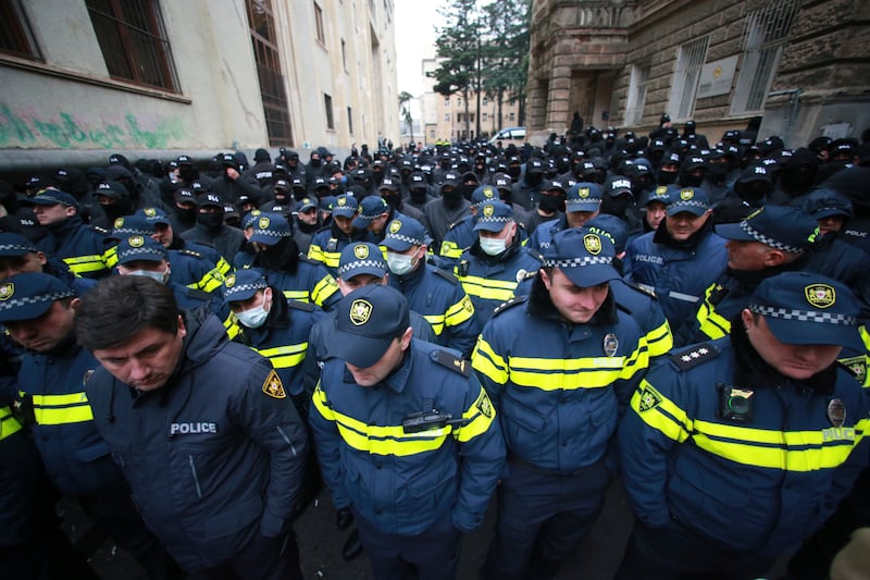 Police block a street in Tbilisi, Georgia, during a rally to demand new parliamentary elections (Zurab Tsertsvadze/AP)