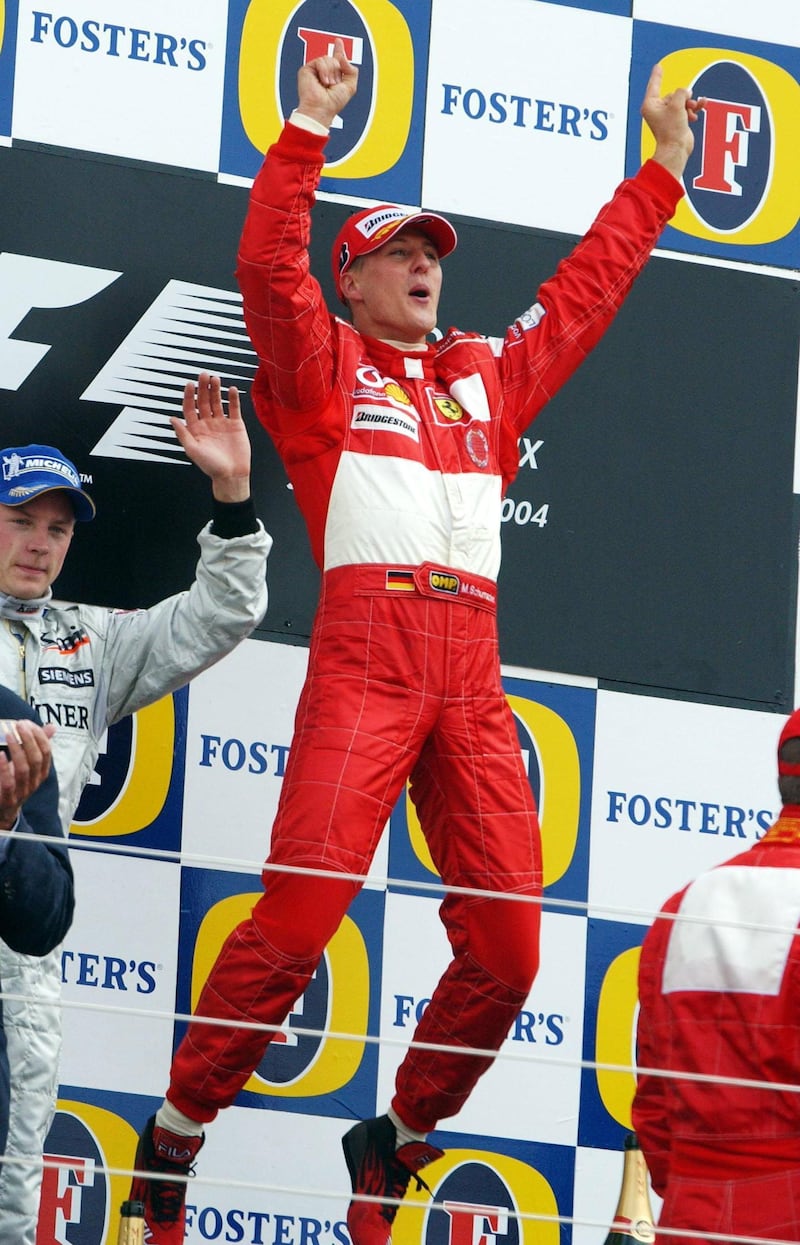 Ferrari’s Michael Schumacher celebrates after winning the British Grand Prix