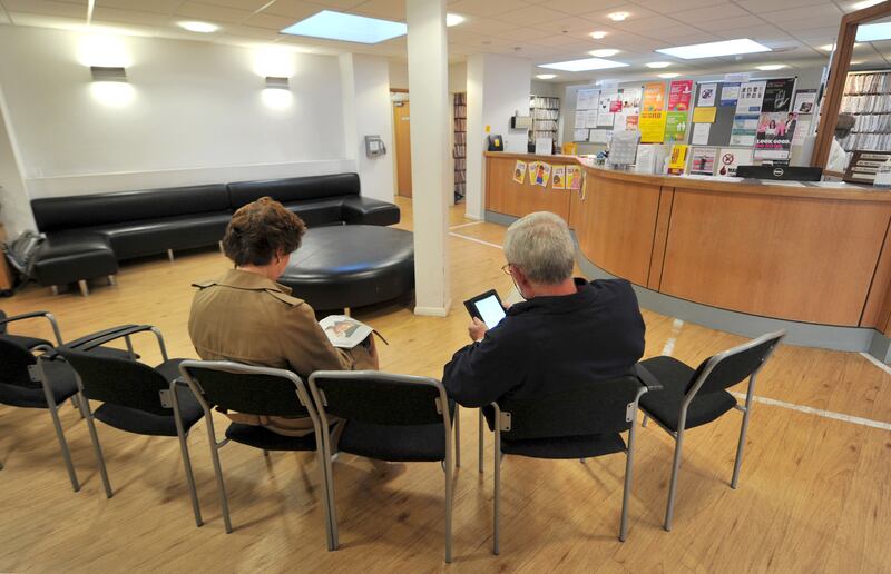 Patients sitting in the waiting room at a GP practice