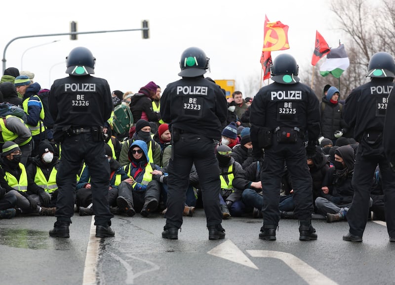 Police stand guard during a demonstration ahead of the AfD’s party conference in Riesa (Jan Woitas/dpa/AP)