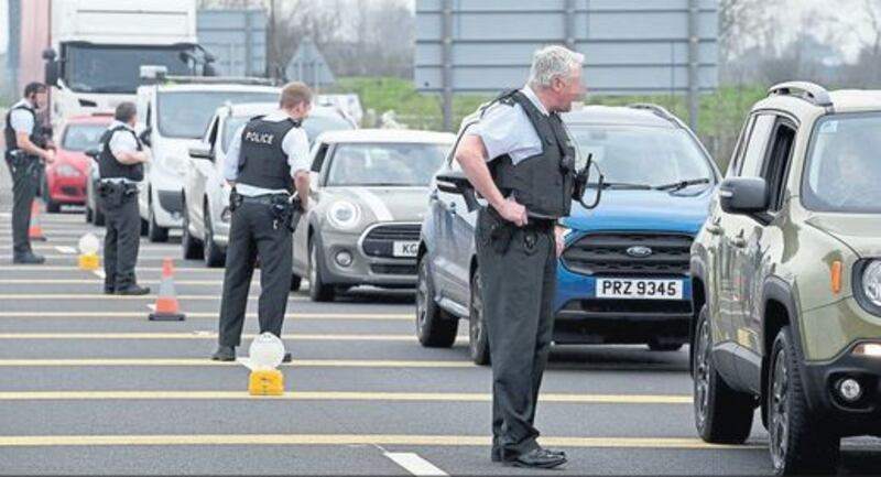 Police stop vehicles on the A26 between Ballymena and Ballymoney, the main road to the north coast, last week. Picture by Justin Kernoghan, Photopress