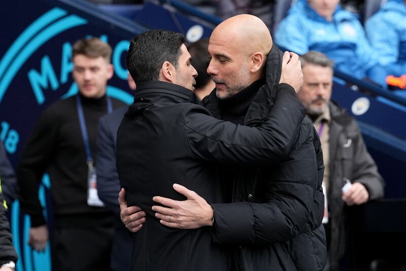 Neither Pep Guardiola, right, nor Mikel Arteta will be throwing in the towel in the title race