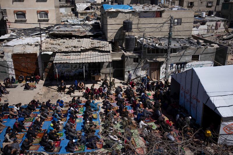 Palestinians perform the first Friday prayers of the Muslim holy month of Ramadan (Fatima Shbair/AP)