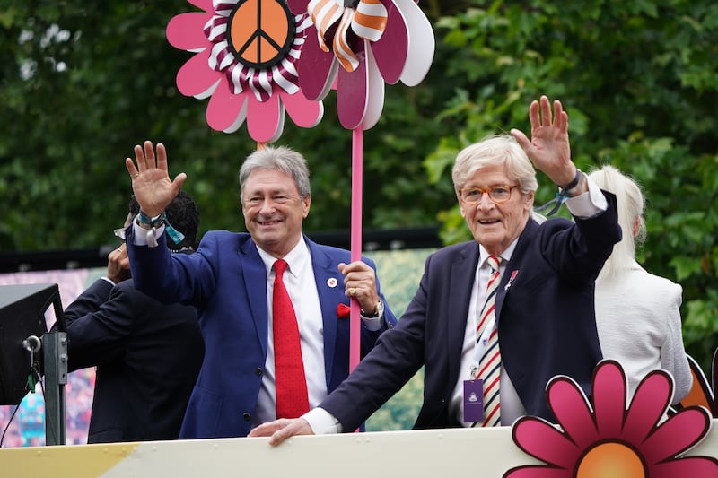 Alan Titchmarsh and William Roache wave to the crowd during the Platinum Jubilee Pageant in front of Buckingham Palace