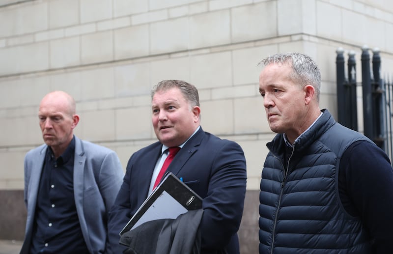 Brothers Brian (left)  and Edward (right)  of Francis Bradley with Solicitor Ciaran Shiels after the findings of an inquest at Laganside Court in Belfast.
PICTURE COLM LENAGHAN