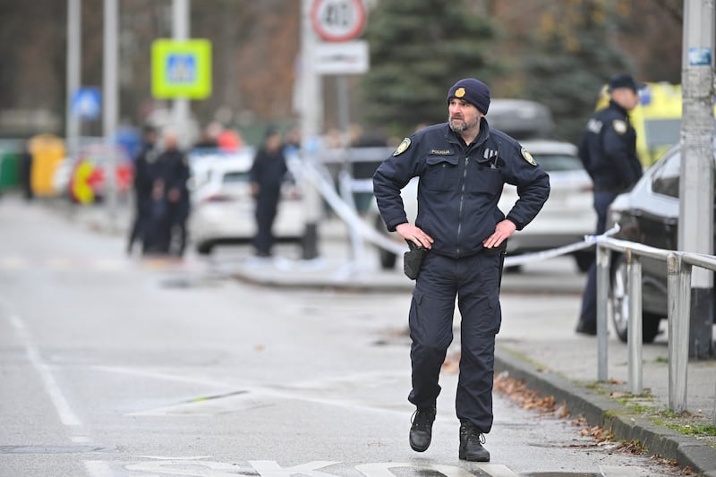 Police secure access to the school where a seven-year-old girl died and a teacher and five other students were wounded in a knife attack in Zagreb (Damir Krajac/AP)