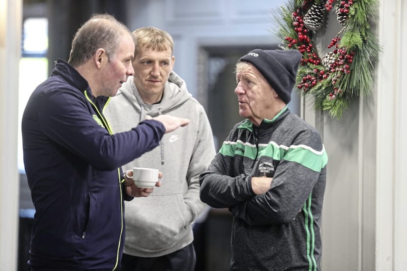 Holy Trinity coaches Michael Hawkins sr and Michael Hawkins jr talk to former Ballymena boxer Eamon Loughran at the Ulster Elite Championship weigh-ins. Picture by Hugh Russell 