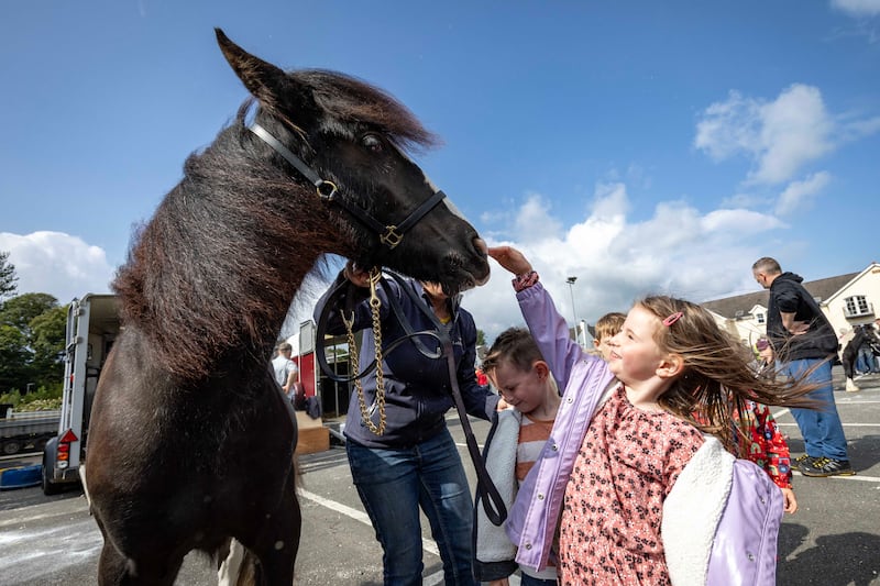 24/24 REPRO FREE.. Clara McCormick meets the horses..

Crowds of locals and visitors made their way to the Lammas Fair this bank holiday weekend.

Events on the Saturday started the fair weekend off with a beach dog ability display, a new addition for 2024. Market stalls lined the streets as visitors enjoyed the Naturally North Coast and Glens Artisan Market.
Mayor of Causeway Coast and Glens Councillor Ciarán McQuillan presented the heavy horse show prizes and also met with the many visitors who came along for the long weekend. Pictures Causeway Coast & Glens Borough Council