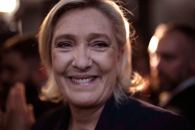 French far right leader Marine Le Pen smiles after delivering her speech after the release of projections based on the actual vote count in select constituencies (AP Photo/Thibault Camus)