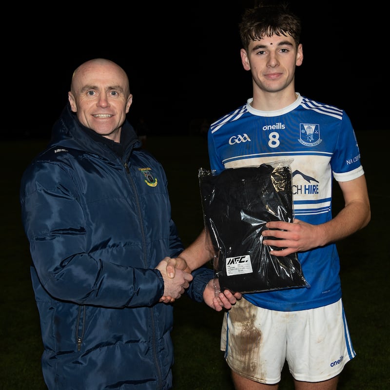 Tomas Carr of Four Masters receives his Man of the Match award after beating Portglenone.