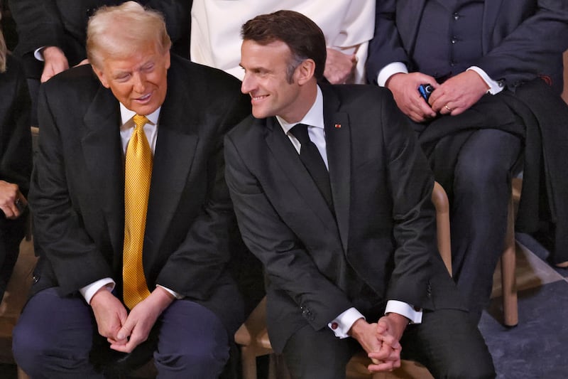 Donald Trump talks with Emmanuel Macron during the ceremony (Ludovic Marin, Pool via AP)