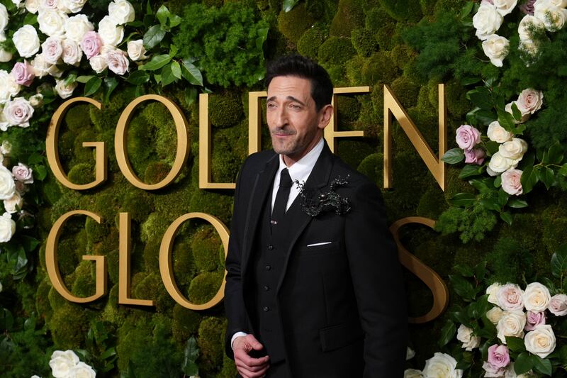 Adrien Brody arrives at the 82nd Golden Globes on Sunday (Jordan Strauss/Invision/AP)