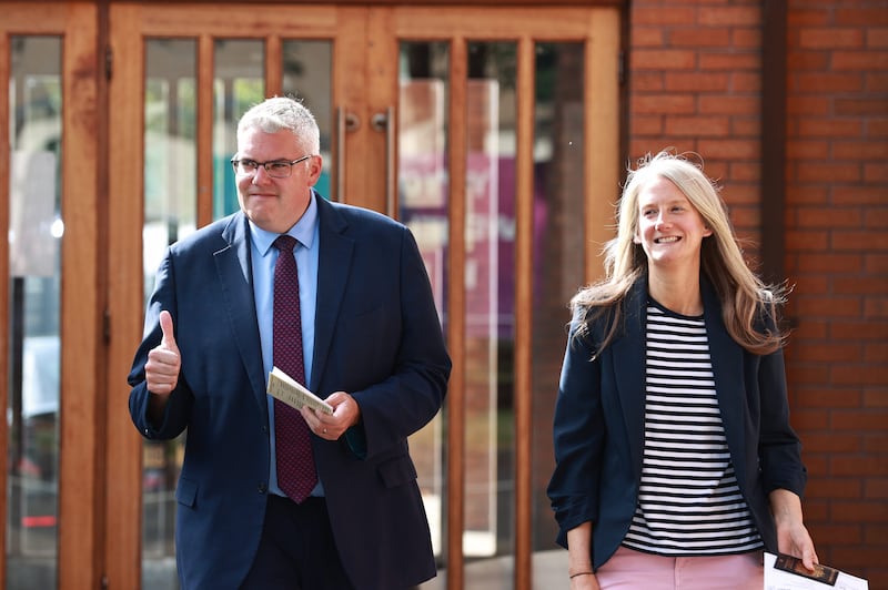 DUP leader Gavin Robinson and his wife Lindsay leave after casting their votes at Dundonald Elim Church in Belfast
