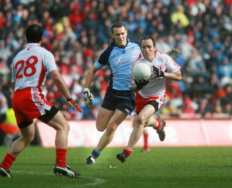 Brian Dooher skips away from Dublin's Ciaran Whelan