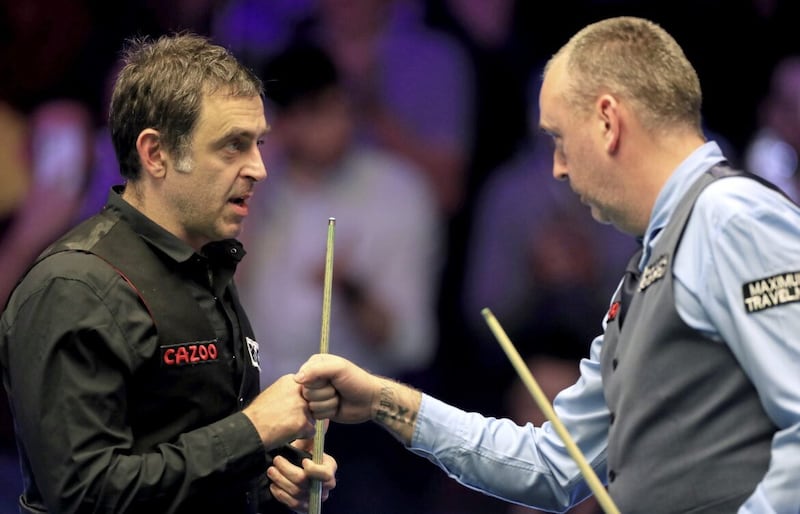 RESPECT Ronnie O&rsquo;Sullivan (left) congratulates Mark Williams after the Welshman had edged their thrilling Cazoo Masters quarter-final 6-5 at Alexandra Palace 