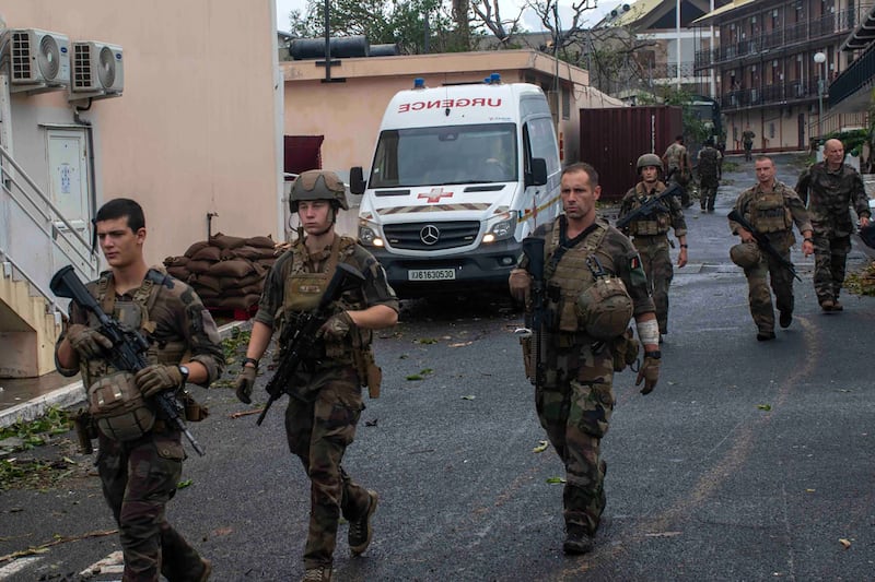 The French Army shows soldiers patrolling in the French territory of Mayotte in the Indian Ocean after Cyclone Chido (Etat Major des Armees via AP)