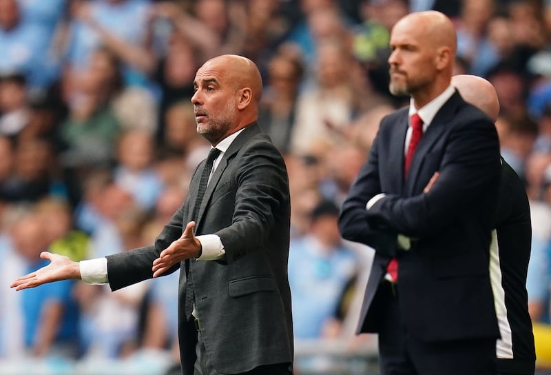 Pep Guardiola, left, and Erik ten Hag on the touchline