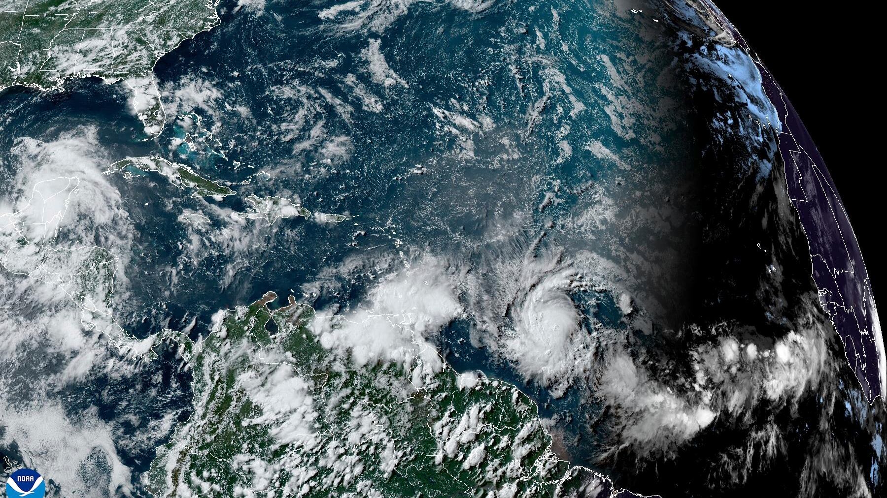 The south-east Caribbean began shutting down on Sunday amid urgent pleas for people to take shelter as Hurricane Beryl is forecast to strengthen into a powerful Category 4 storm (National Oceanic and Atmospheric Administration/AP)