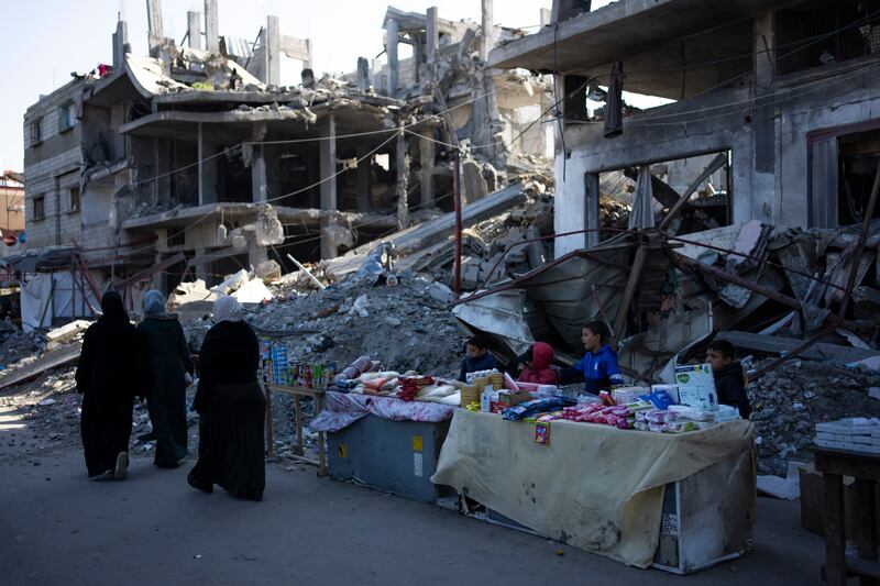 Buildings destroyed by an Israeli air strike in Rafah (Fatima Shbair/AP)