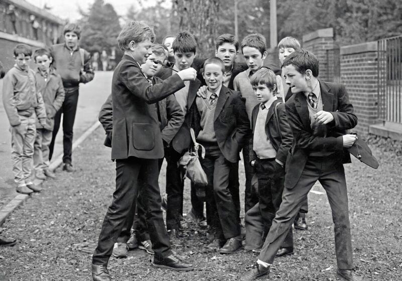 Pupils from St Patrick&#39;s College, Bearnageeha on the Antrim Road in north Belfast play conkers during a lunch break in 1994. A favourite past time for generations of children during the months of September and October, the game is played with seeds of horse chesnut trees gathered from the ground and threaded onto strings, with players taking turns to strike each other&#39;s conker until one breaks. PICTURE: BRENDAN MURPHY. 