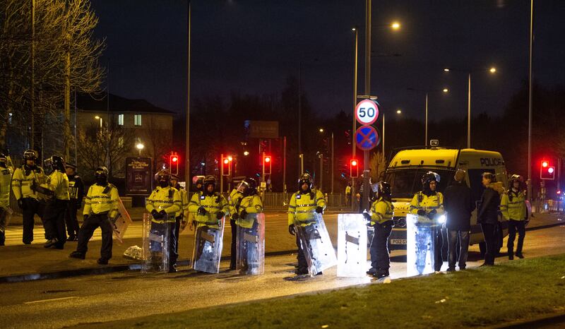 Police in riot gear during the protest outside the Suites Hotel in Knowsley, Merseyside, in February 2023