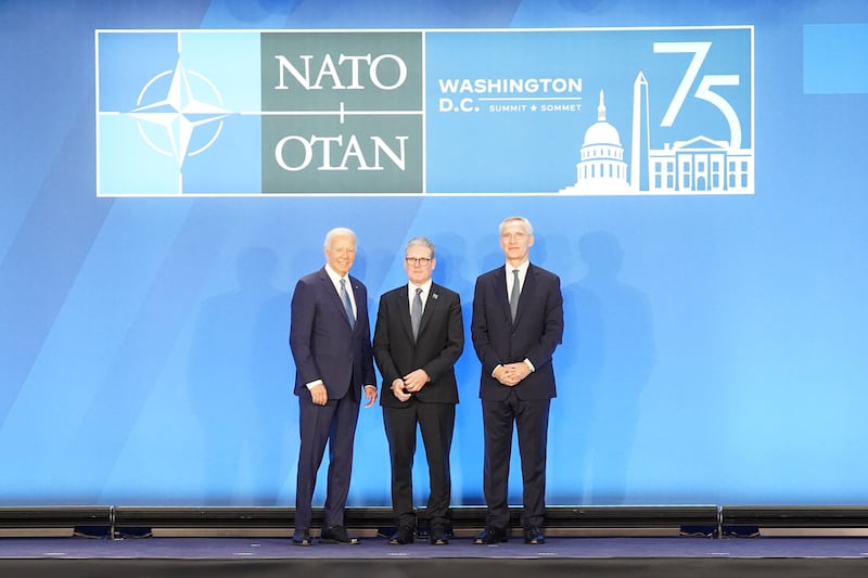 Prime Minister Sir Keir Starmer is greeted by US President Joe Biden and Nato Secretary General Jens Stoltenberg at the Nato summit