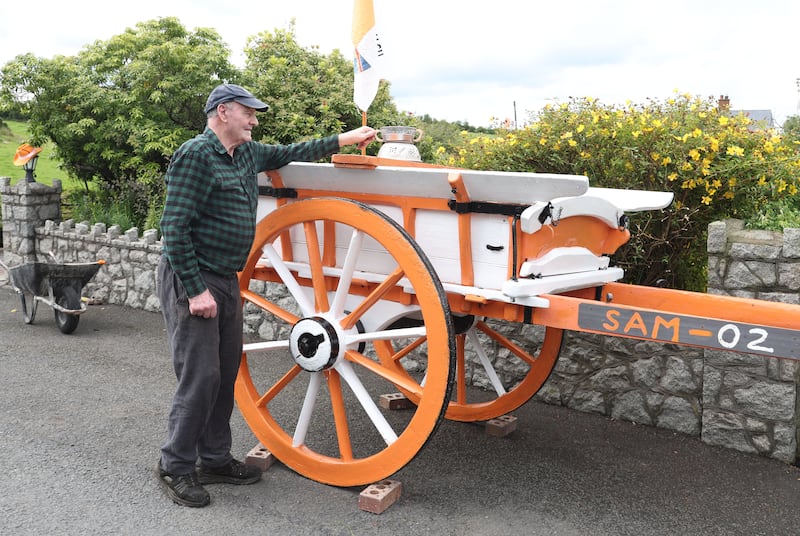 Seamus Morgan who painted his cart, near Crossmaglen  ahead of the All Ireland Final on Sunday.
COLM LENAGHAN