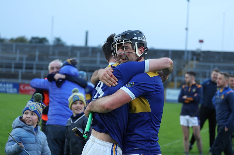 Portaferry’s Matthew Conlan and Tom Murray  celebrate after  lifting  the  Down GAA Senior Hurling Championship trophy at Pairs Esler on Sunday.
PICTURE COLM LENAGHAN