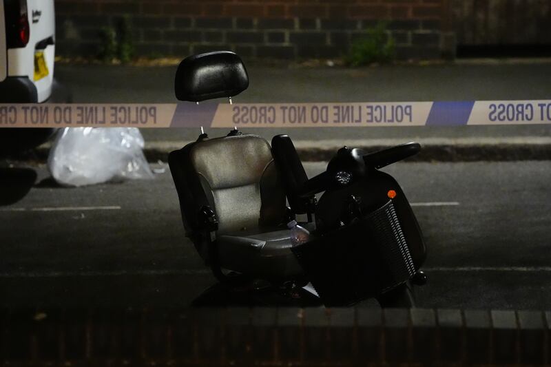 A black and grey electric wheelchair on Overbury Street near the scene in Rushmore Road, Clapton, east London