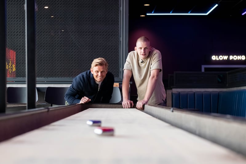 Jeff and Freddy Brazier play Shuffleboard at the new Butlin’s PLAYEXPERIENCE