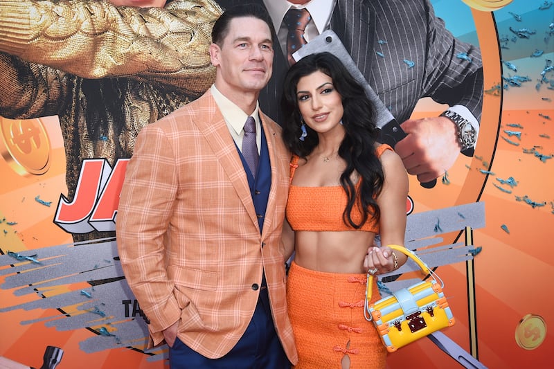 John Cena, left, and Shay Shariatzadeh arrive at the LA Premiere of Jackpot! at the TCL Chinese Theatre (Richard Shotwell/Invision/AP)