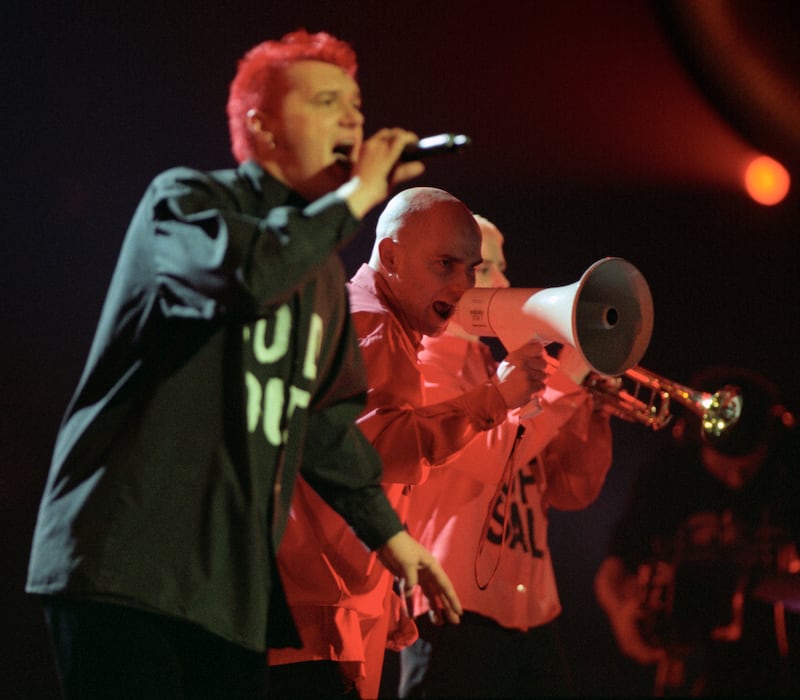 Chumbawamba perform their hit single Tubthumping at the start of the Brit Awards ceremony in 1998